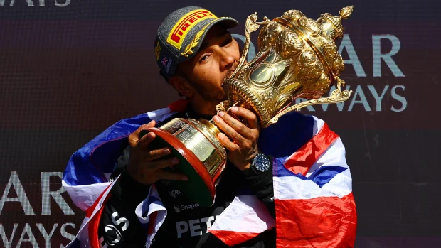 Hamilton celebrating win at Silverstone